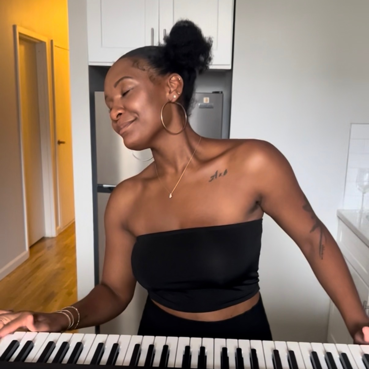 Precious Elam playing the piano